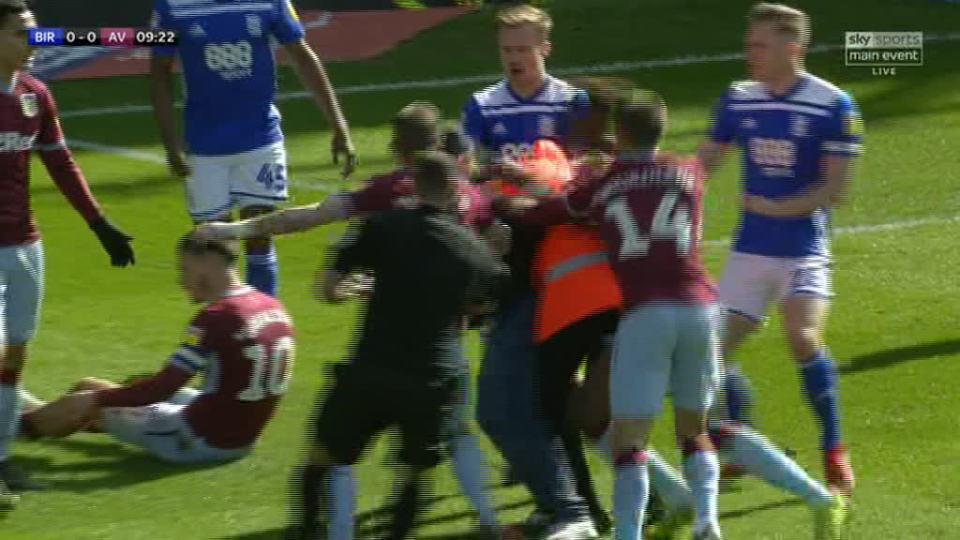  Players from both sides and a steward then ran towards the aggressor and managed to get him off the pitch