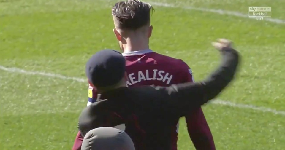  Aston Villa ace Jack Grealish was attacked on live TV, Sunday, by a fan who invaded the pitch