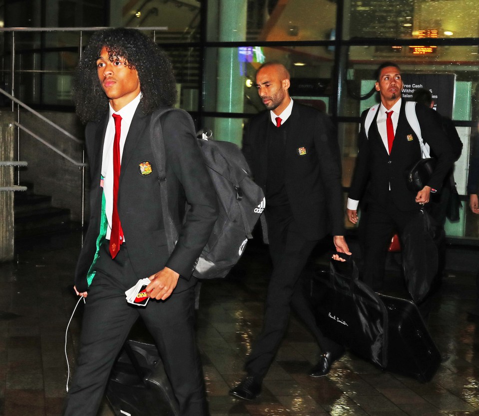  The team arrived back in Manchester just before 11pm with Tahith Chong carrying classic game Uno