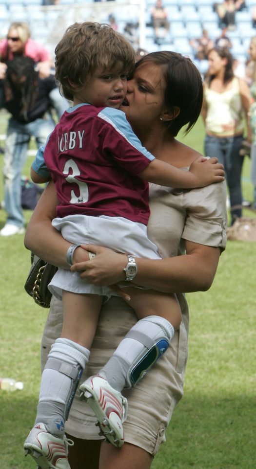  Jade carries Bobby at a charity football match in May 2007