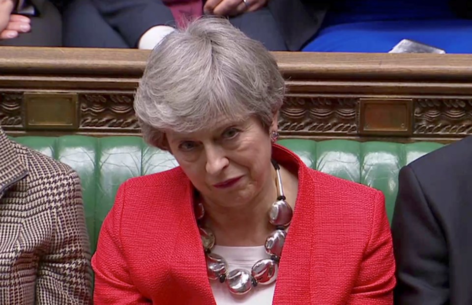  The PM looks dejected after tellers announce her Brexit deal has been shot down by 391 votes to 242