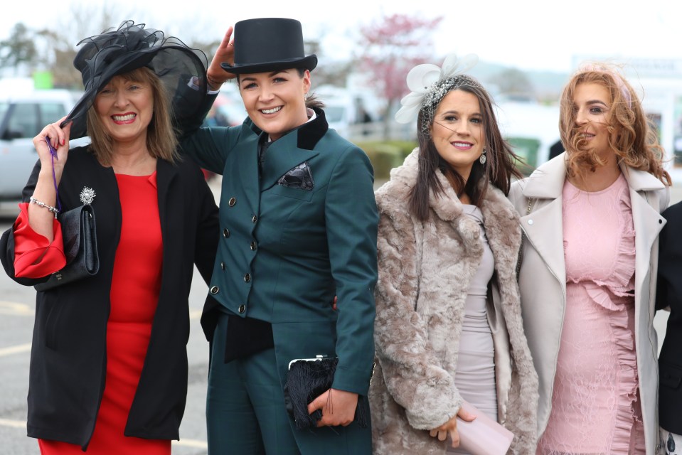  Despite weather warnings, revellers were in high spirits as they arrived for Ladies Day