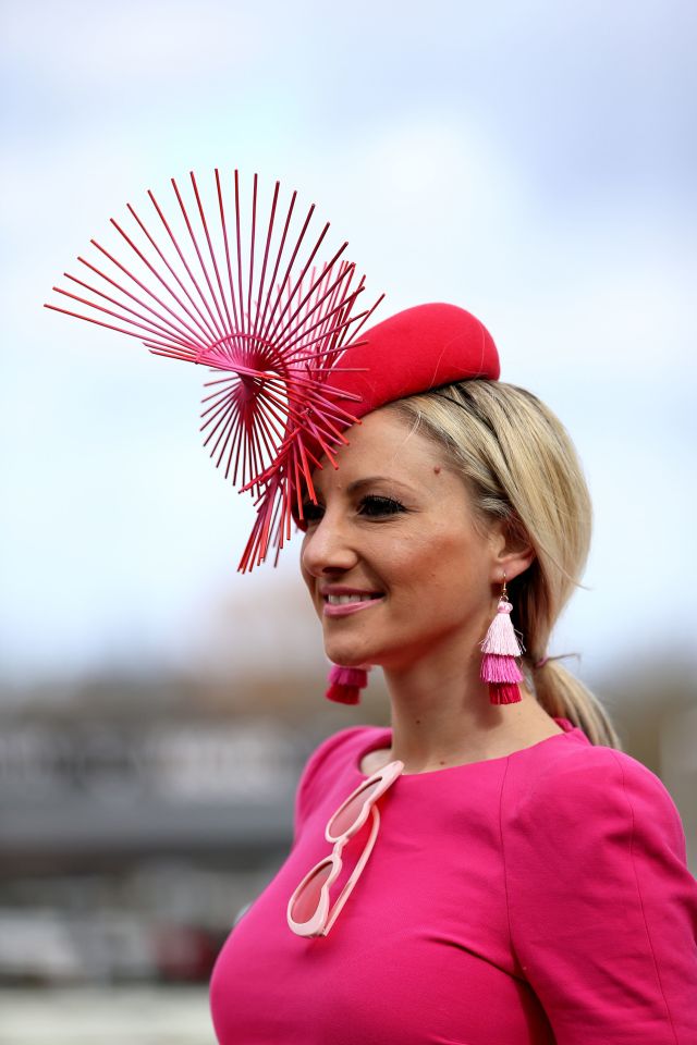  This woman looked pretty in pink she dazzled with this striking fascinator and matching tassle earrings