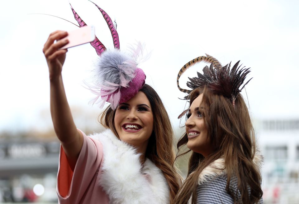  Faux fur and feathers were popular with these two pals at the racecourse