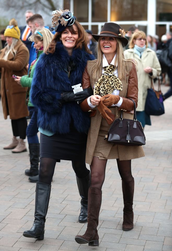  Two pals appeared to be having the time of their life and cut a fashionable pair with matching knee-high boots