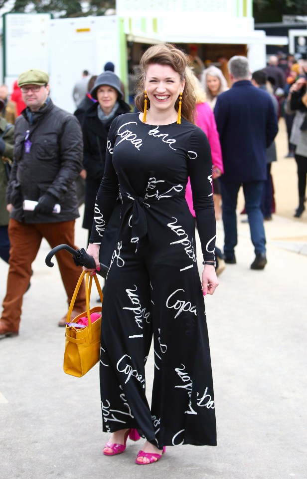  This beaming guest certainly made a statement with her slogan jumpsuit and colourful accessories