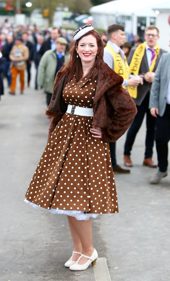  While tartan and bold pinks were a popular trend, this woman went for an all-brown outfit, including a polkadot prom-style dress