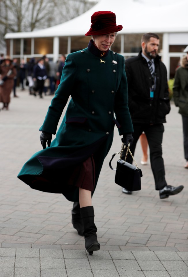  Princess Anne opted for an emerald green coat and red hat for the horse-filled day