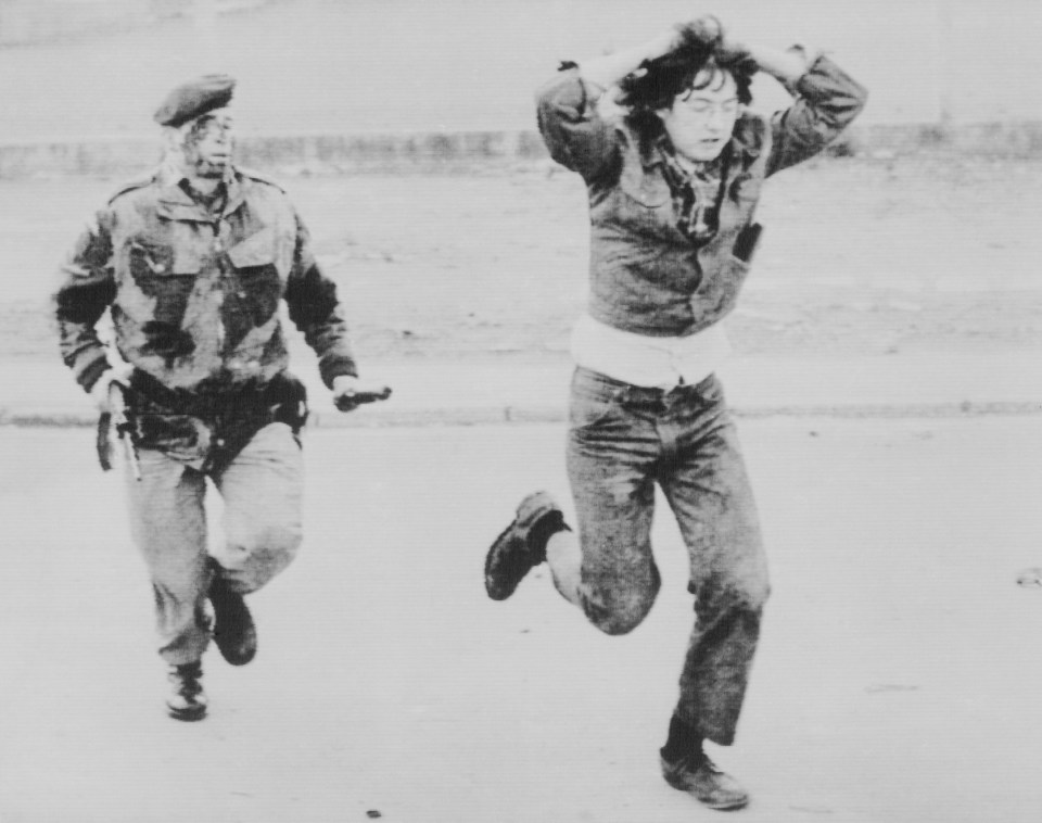  A demonstrator is chased into custody by a British soldier