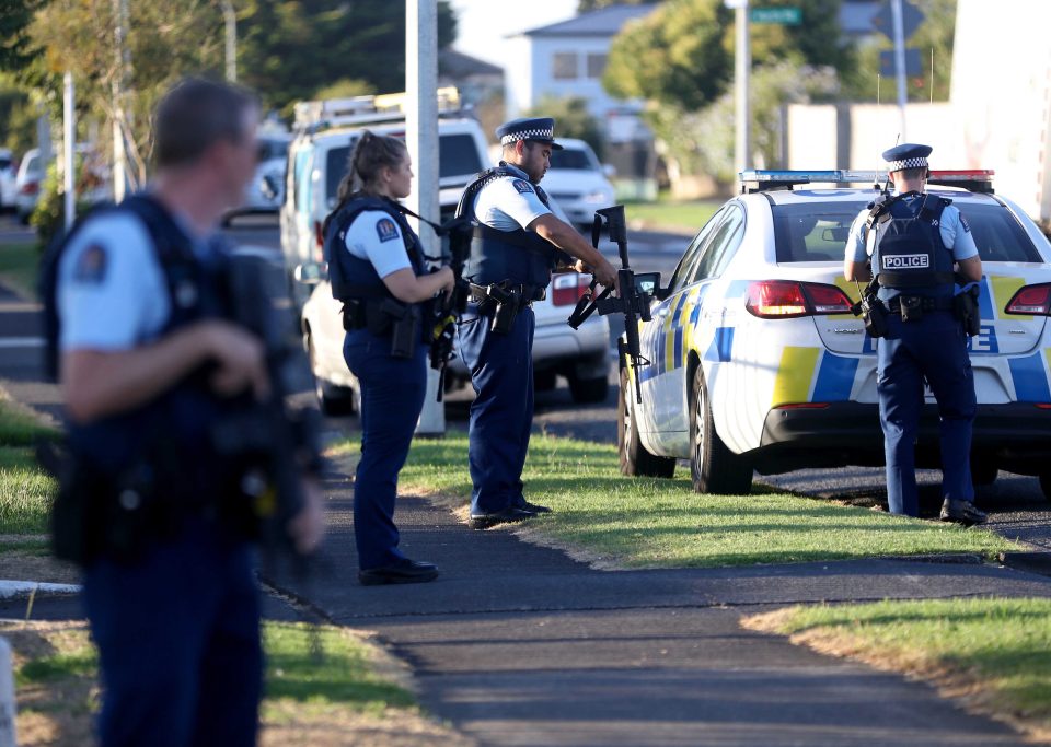  Armed police stand guard outside the Masijd Ayesha Mosque in Manurewa, Auckland