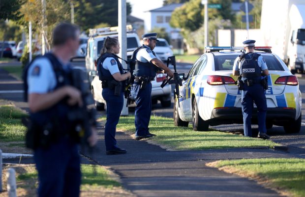 Armed police maintain a presence outside the Masijd Ayesha Mosque in Manurewa