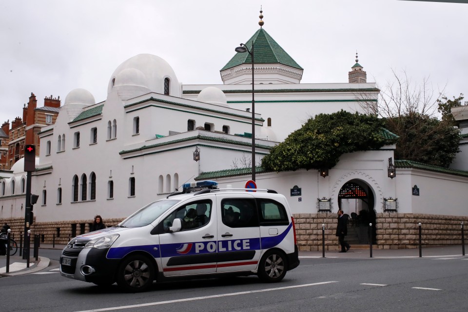  A police car stands outside the Grand Mosque in Paris