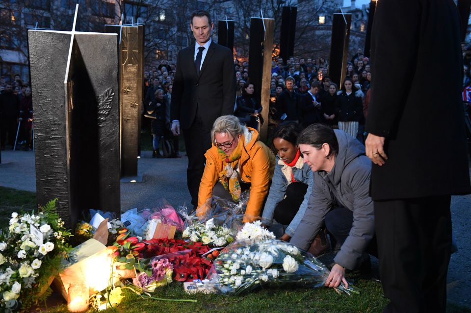  People taking part in a vigil at the New Zealand War Memorial on Hyde Park Corner following the mosque attacks in Christchurch