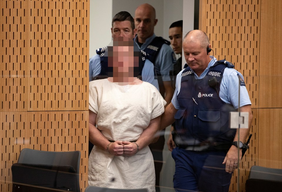  Handcuffed and barefoot, he appeared at Christchurch District Court today under heavy security