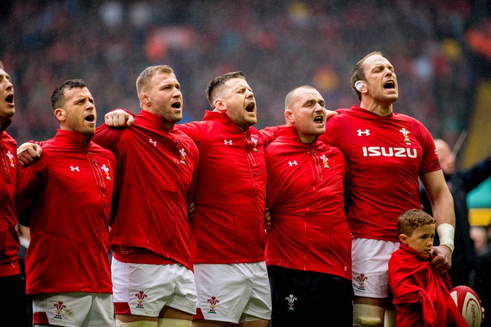  Alun Wyn Jones wrapped his jacket round the young mascot who was shivering in the stormy conditions