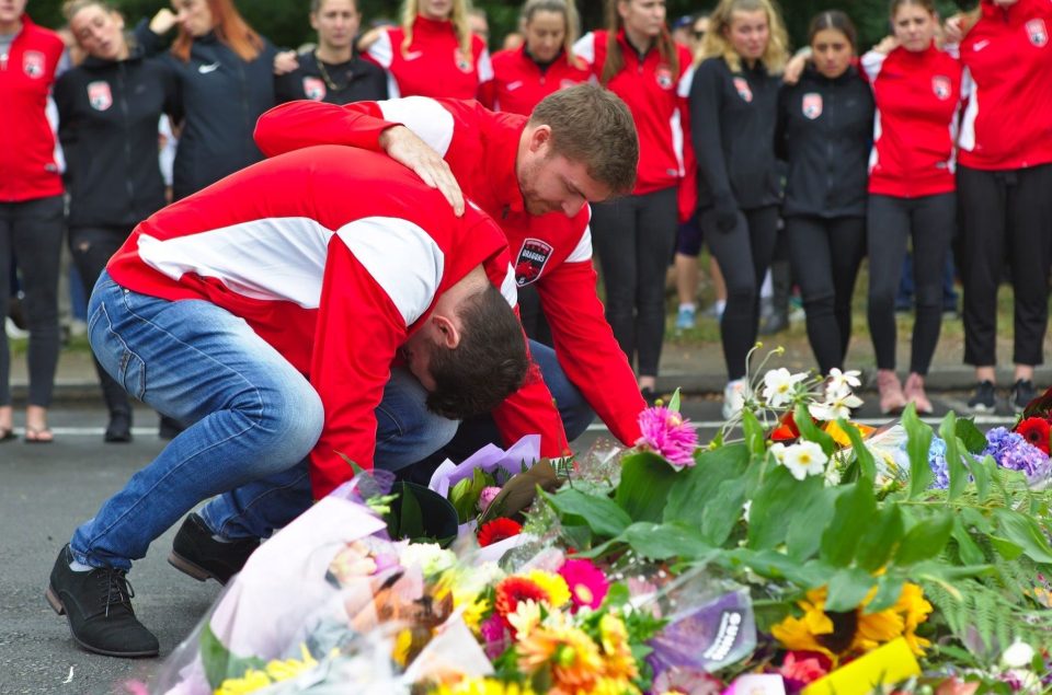  People lay flowers in front of the Masjid Al Noor Mosque during a public vigil