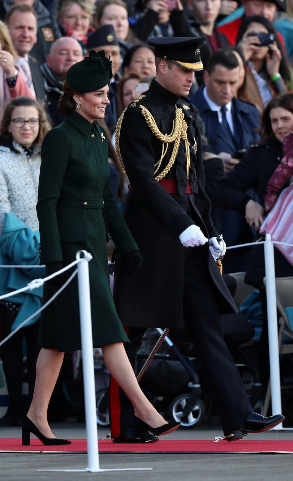  Kate Middleton and Prince William smile as they arrive for the St Patrick's Day event