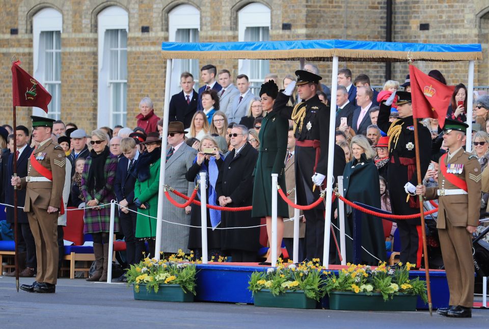  The royal couple stand to attention for the parade