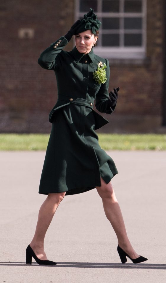  The 37-year-old holds her hat down as she walks