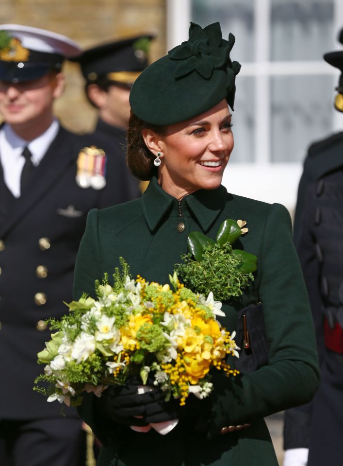  Kate Middleton holds a bouquet during the ceremony