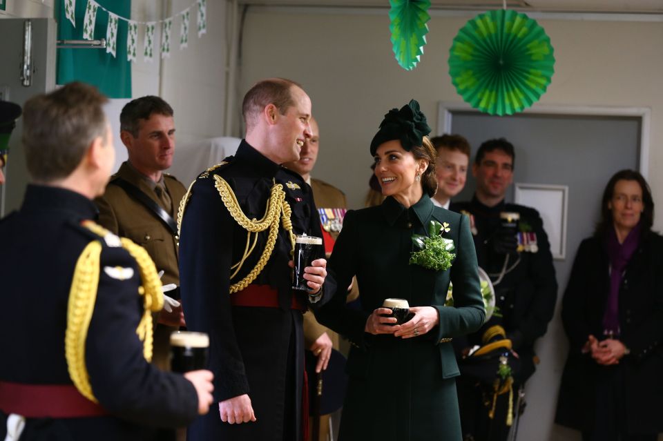  The Duke and Duchess of Cambridge share a joke as they drink some Guinness