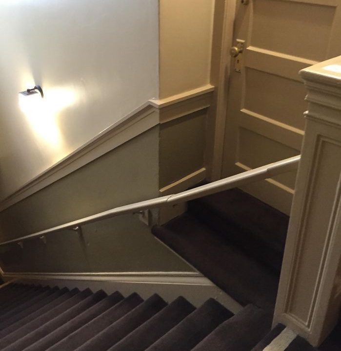  It isn't clear if the rail is meant to keep people out or prevent people falling down the stairs