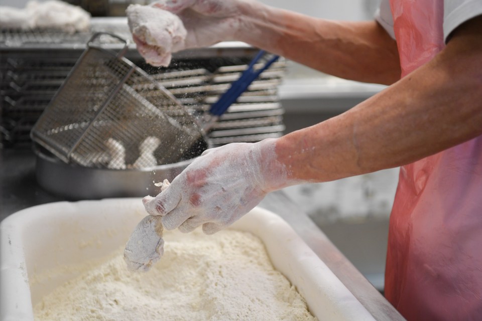  You have to shake off the excess flour before it goes in the fryer