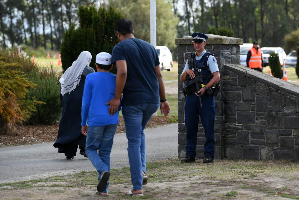  Emotional mourners were watched over by armed police as the funerals of Khaled Mustafa, 44, and his son Hamza, 16, took place on Wednesday