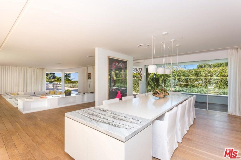  This sleek dining area leads on from the open-plan lounge