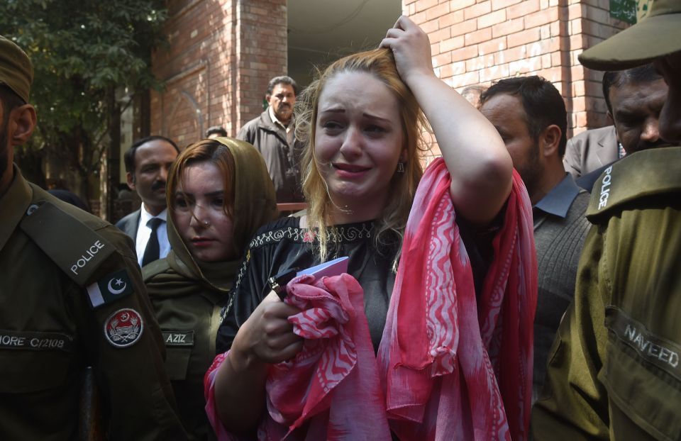 Tereza Hluskova weeps after a court in Lahore sentenced her to more than eight years in prison today