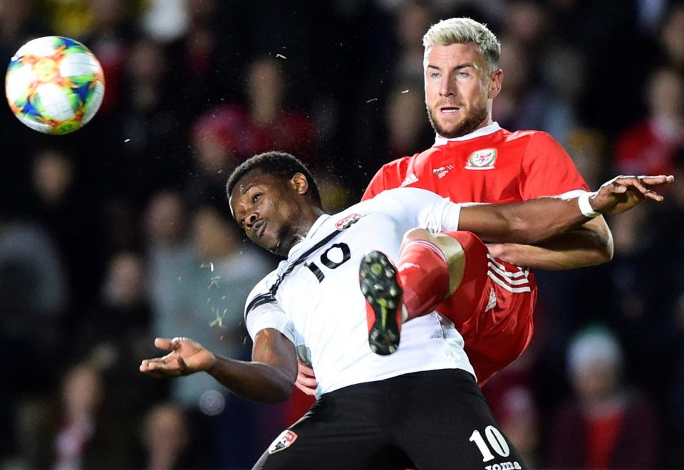  Paul Dummett tries to nick the ball from Trinidad & Tobago winger Levi Garcia