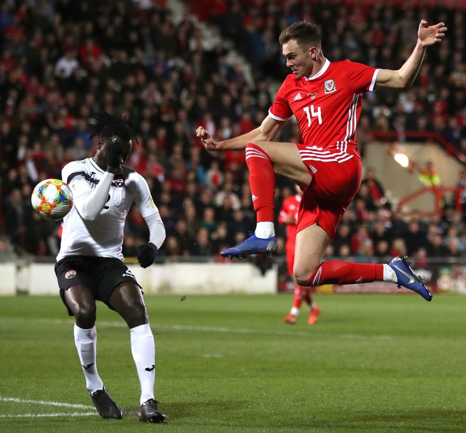  Aubrey David fails to halt Barnsley's Wales striker Ryan Hedges in the friendly at the Racecourse Ground, home of National League side Wrexham.