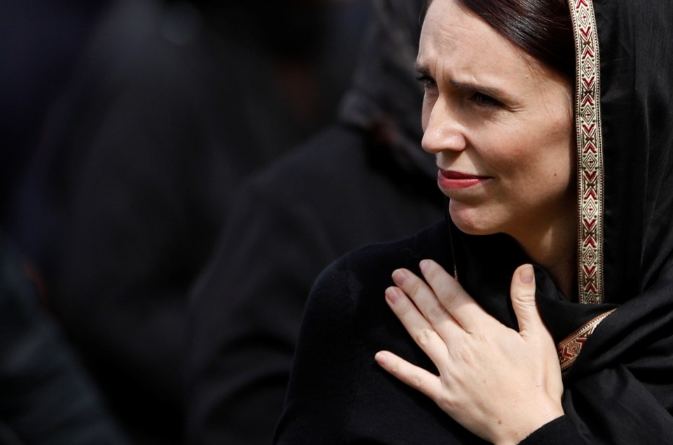 Jacinda Ardern gestures as she departs following a gathering for congregational Friday prayers and two minutes of silence for victims of the twin mosque massacre