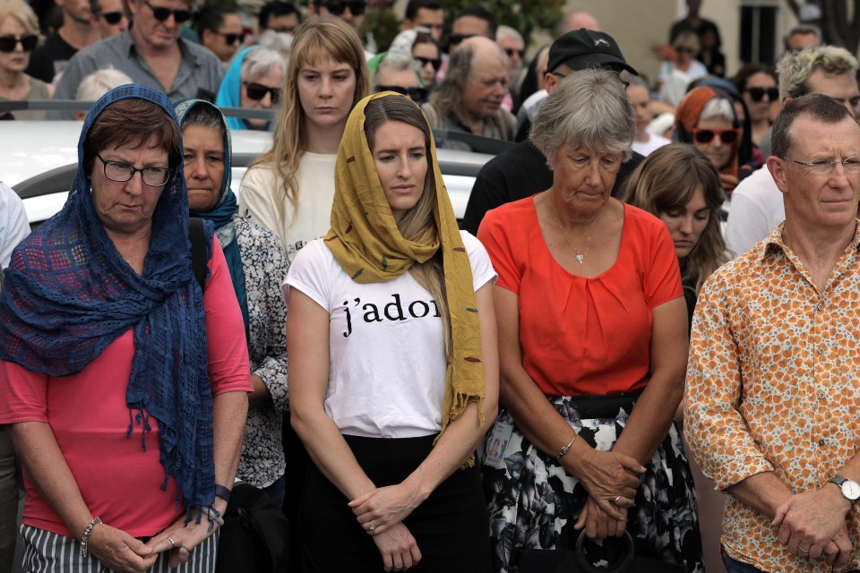 Local residents with head scarfs gather for the call to prayer and the moments silence at Masjid Umar mosque in Auckland