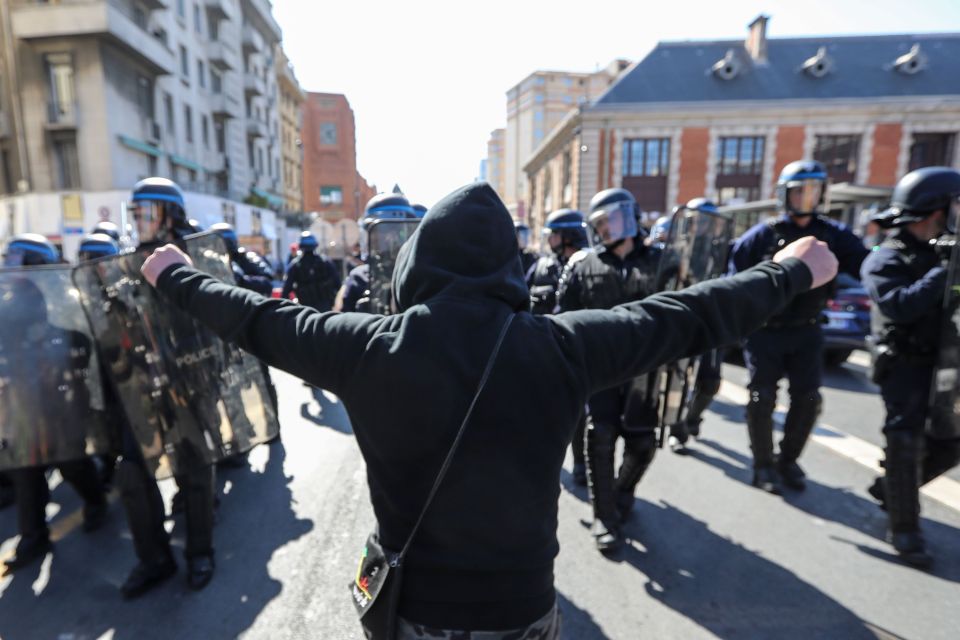  A man faces down cops during the clashes on France's south coast