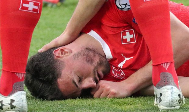 Both players and medics rushed to help Switzerland centre-back Fabian Schar after smashing heads with Georgia defender Jemal Tabidze