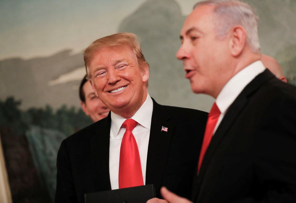  Trumps smiles at Netanyahu after the signing of the proclamation