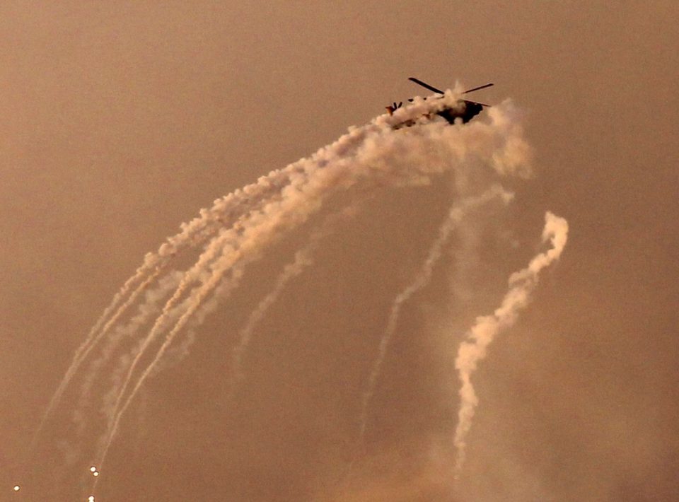  An Israeli helicopter shoots flares over the Gaza Strip last night