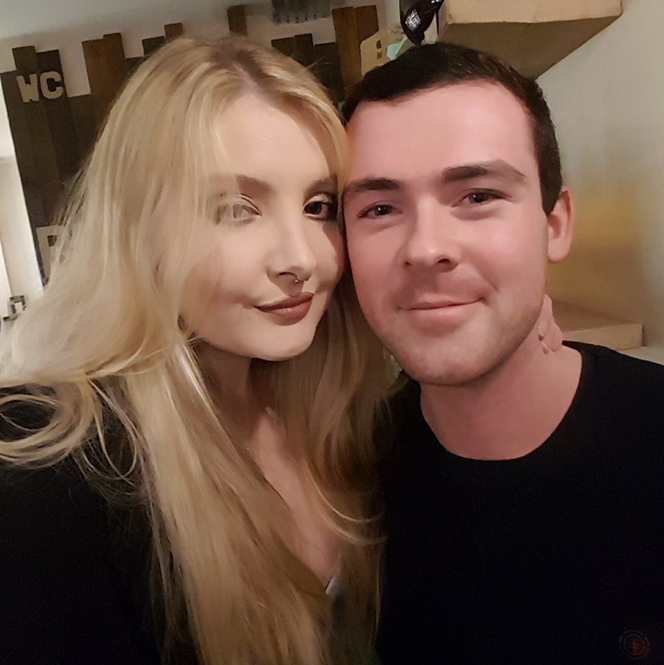 Scott Bate's Facebook profile picture shows Katie with her arm around his neck