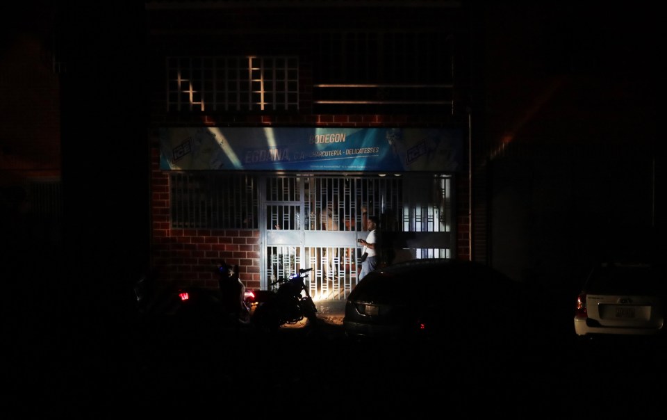  A shop is illuminated by the lamp of a motorcycle