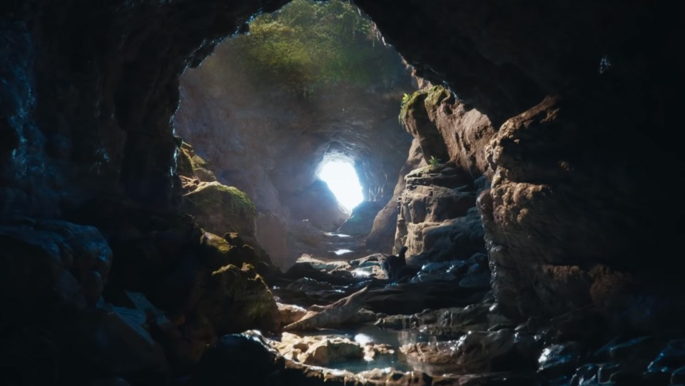  The cave interior is rendered in glorious detail, with seemingly dynamic reflections and ripple effects on the water