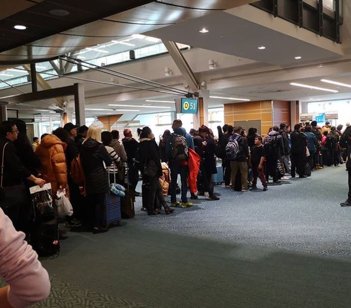  One passenger shared a picture of the queues at Vancouver Airport, saying: 'Super long delay at Vancouver Airport by Air Canada'