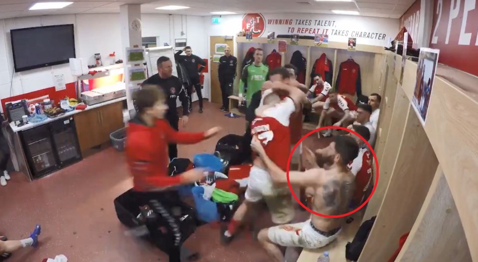 Ched Evans, circled, intervenes in a dressing room brawl