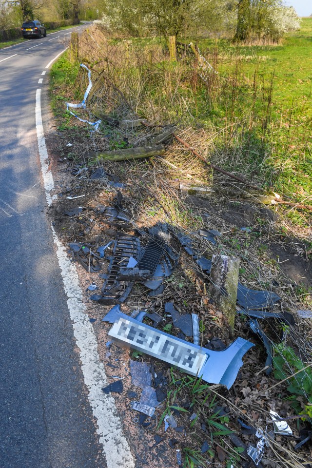  The crash left debris strewn across the country road in Hale, Gtr Manchester, and a fence was flattened