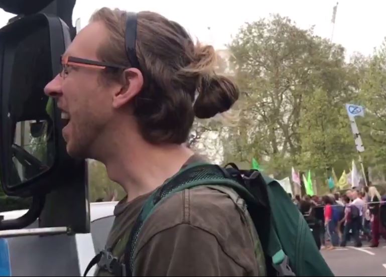 The campaigner, who had his hair tied in a ‘man bun’, said he was ‘grateful’ to the lorry driver for waiting in traffic