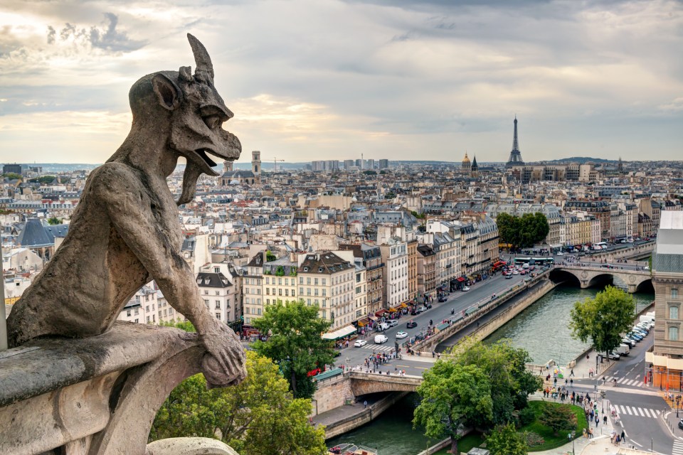 One of the church's chimera (gargoyles) overlooking Paris, France