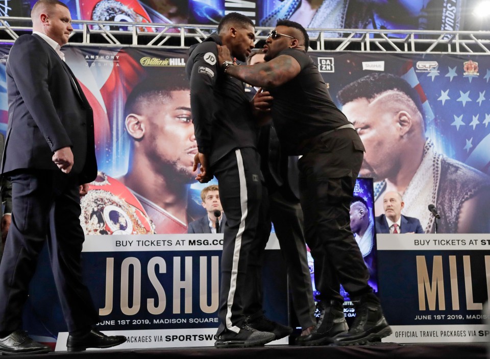  Miller is seen shoving Joshua as they posed for photos during a news conference in February