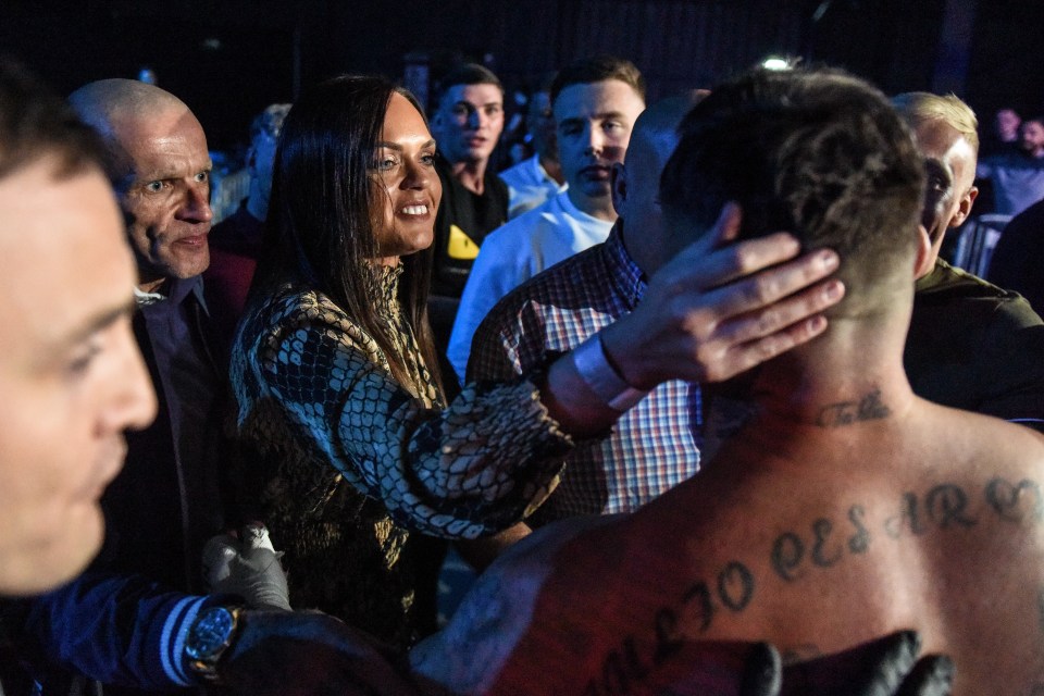  A boxer is congratulated by his partner after winning his gruelling fight