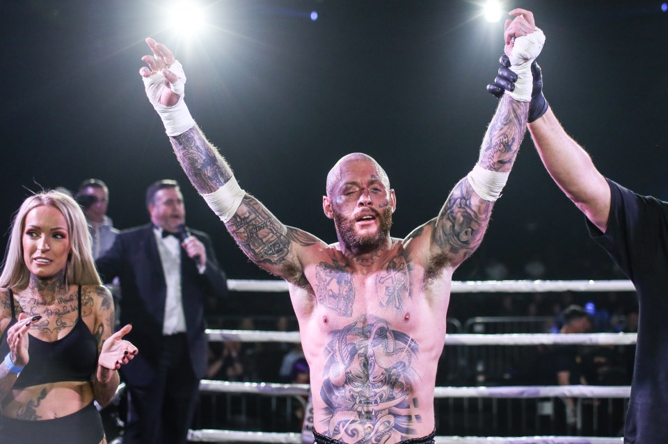  Chris Wheeldon is applauded by a Ring Girl after his victory