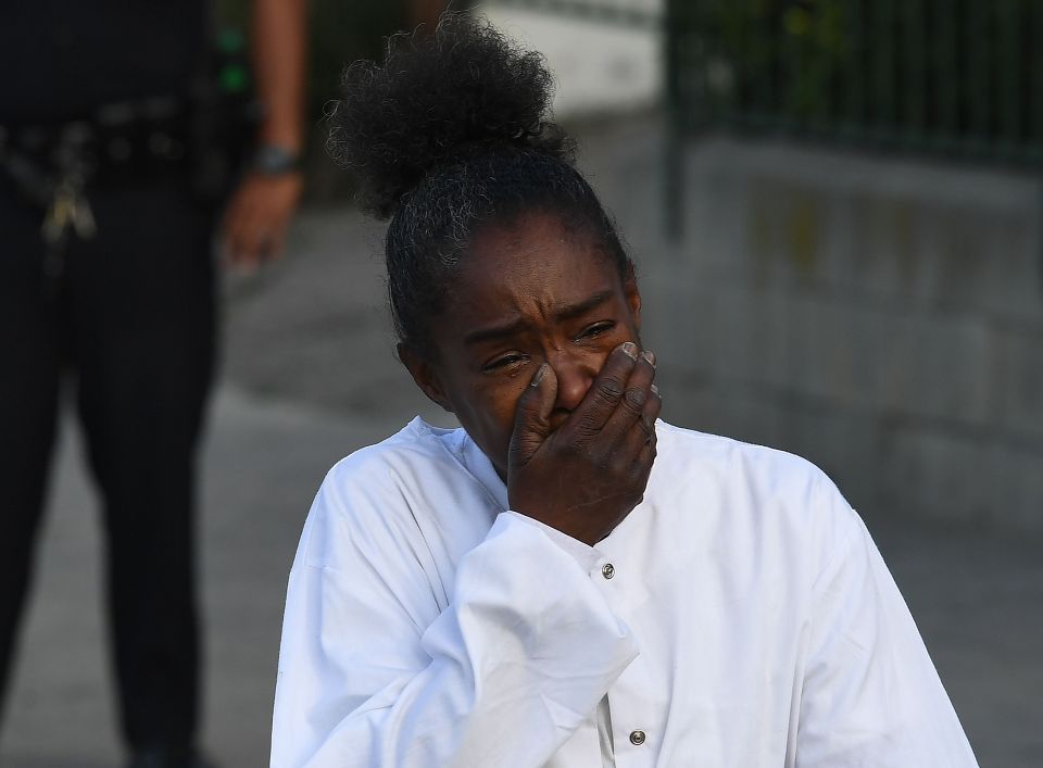  A young woman cries at the scene of the killing